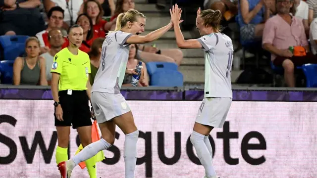 Norway's forward #14 Ada Hegerberg (L) celebrates with a teammate after scoring the team's first goal during the UEFA Women's Euro 2025 Group A football match between Switzerland and Norway at the St Jakob-Park Stadium in Basel on July 2, 2025.