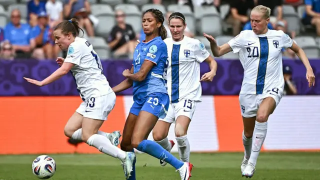 Finland's midfielder #13 Oona Siren, Iceland's forward #23 Sveindis Jane Jonsdottir, Finland's defender #15 Natalia Kuikka and Finland's midfielder #20 Eveliina Summanen fight for the ball during the UEFA Women's Euro 2025 Group A football match between Iceland and Finland at the Arena Thun stadium in Thun on July 2