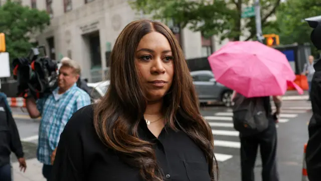 Holly Baird, publicist of Sean "Diddy" Combs, walks outside the court