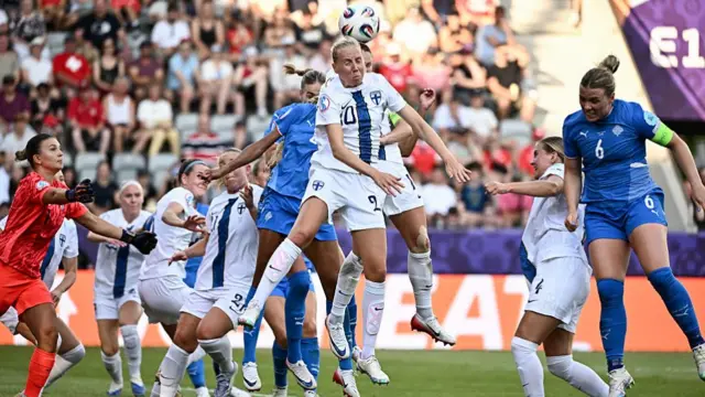 Finland's midfielder #20 Eveliina Summanen (C) jumps to head the basll during the UEFA Women's Euro 2025 Group A football match between Iceland and Finland at the Arena Thun stadium in Thun on July 2, 2025.