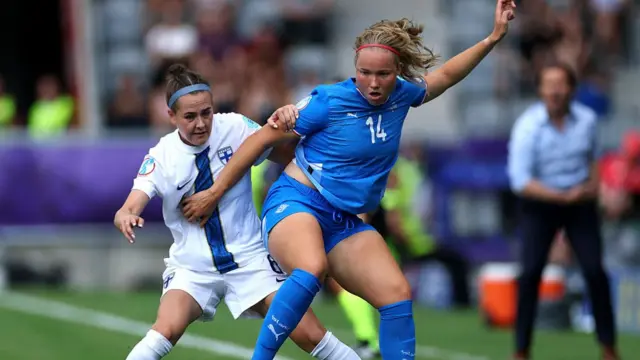 Hlin Eiriksdottir of Iceland is challenged by Joanna Tynnila of Finland during the UEFA Women's EURO 2025 Group A match between Iceland and Finland at Arena Thun