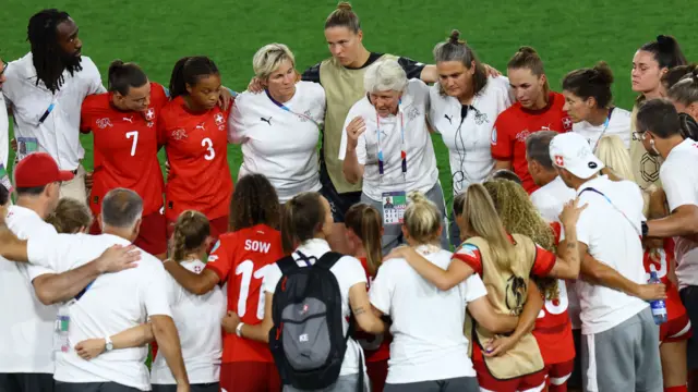 Switzerland coach Pia Sundhage with players look dejected after the match