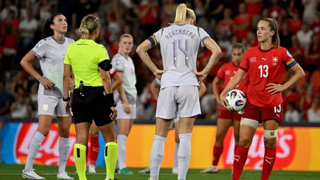 Norway's forward #14 Ada Hegerberg and Switzerland's midfielder #13 Lia Walti wait for the VAR discission during the UEFA Women's Euro 2025 Group A football match between Switzerland and Norway at the St Jakob-Park Stadium in Basel on July 2, 2025.