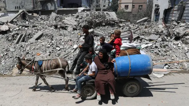 Gazans on a loaded donkey cart leaving an area targeted by the IDF on 29 June 2025