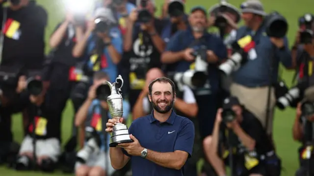 Scottie Scheffler holds the Claret Jug
