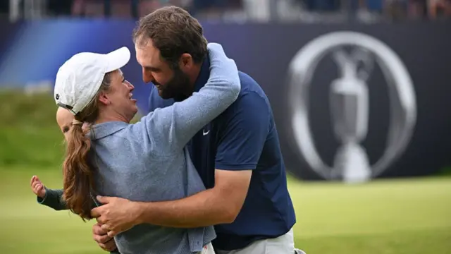 Scheffler with his wife at The Open