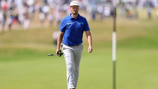 Wyndham Clark walks with his putter at The Open 2025