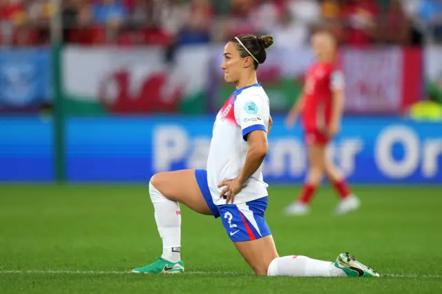 England's Lucy Bronze takes the knee