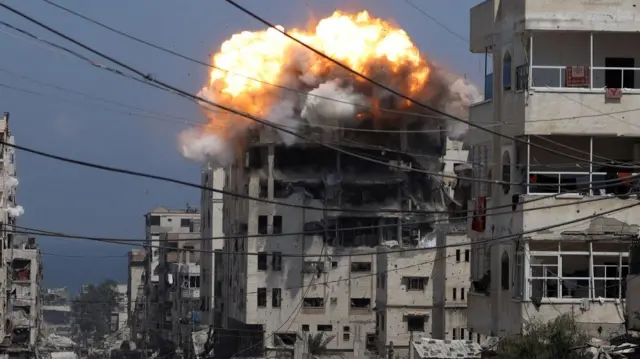 The moment of explosion as a strike hits a concrete building in Gaza