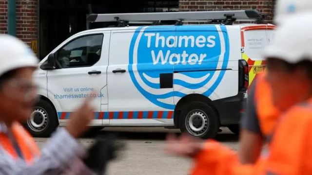 A Thames Water van and workers