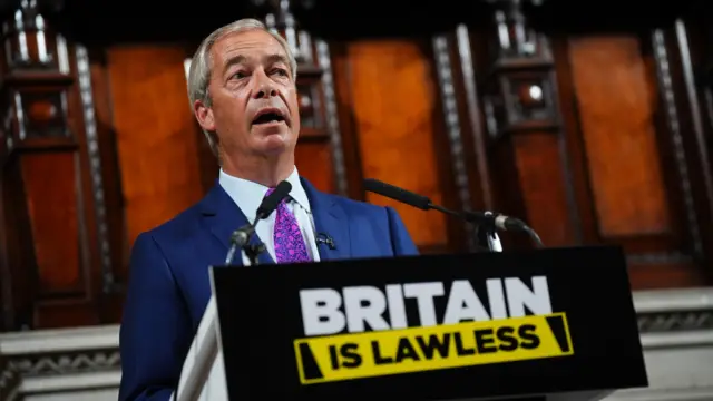 Nigel Farage speaking at a podium