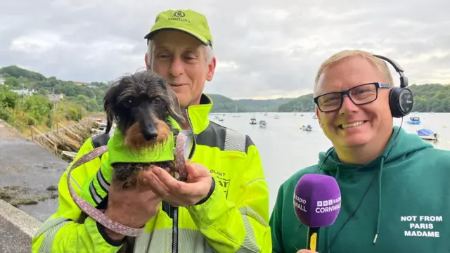 Mr Anderson and Ruby stood by the river next to the BBC's James Churchfield