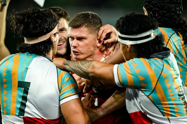 Charlie Gamble (number seven) fronts up to Owen Farrell