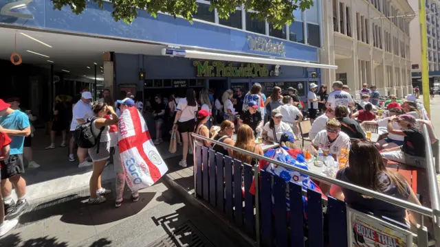 England supporters sitting outside Mr Pickwick Pub in Geneva