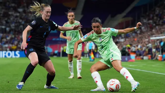 Lucia Di Guglielmo of Italy controls the ball under pressure from Keira Walsh of England