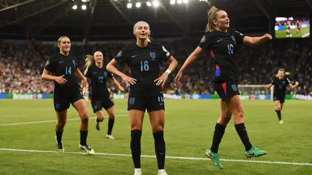 Chloe Kelly of England celebrates scoring her team's second goal from a rebound following a saved penalty in extra-time