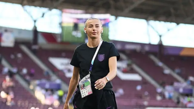 Chloe Kelly of England inspects the pitch