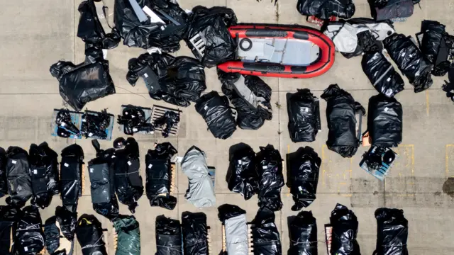 A picture taken with a drone shows small boats used by migrants crossing the English Channel, stored at a UK Home Office facility in Dover.