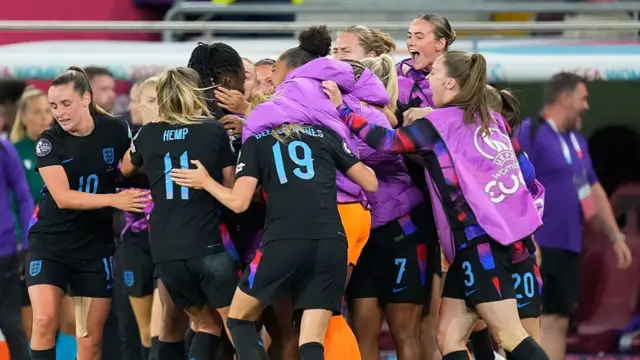 Michelle Agyemang of England celebrates scoring her team's first goal with teammate Ella Toone