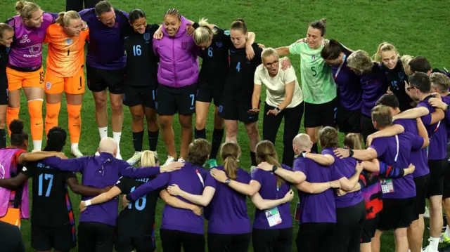 Sarina Wiegman, Head Coach of England, leads a post match team talk after the teams victory and progression to the final