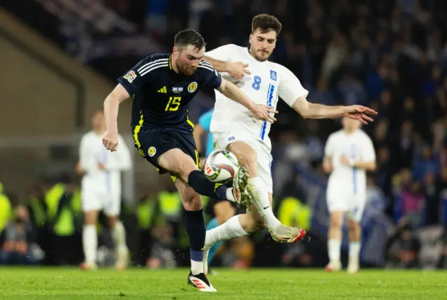 Scotland's John Souttar (L) and Greece forward Fotis Ioannidis (R)