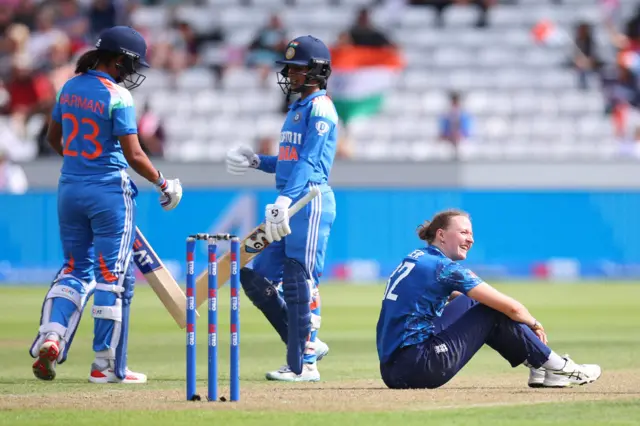 England's Lauren Filer reacts as India's Jemimah Rodrigues and Harmanpreet Kaur looks on