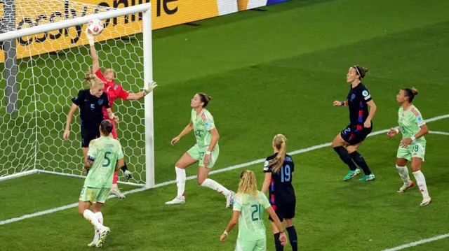 Laura Giuliani of Italy makes a save whilst under pressure from Alex Greenwood of England