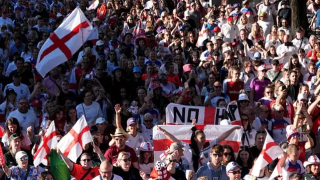 England fans take part in a fan walk to the stadium