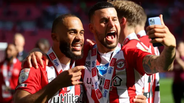 Emiliano Marcondes and Bryan Mbeumo celebrate after victory at Wembley