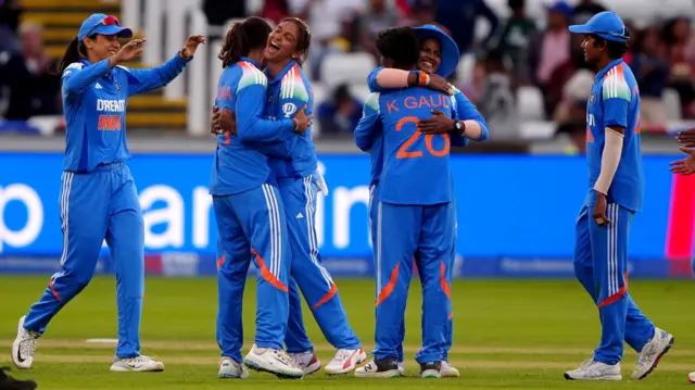 India celebrate the wicket of England's Lauren Filer