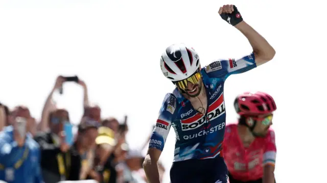 Valentin Paret-Peintre celebrates winning stage 16 of the Tour de France