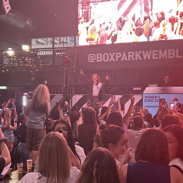 Fans dance to Jess Glynne at Boxpark Wembley