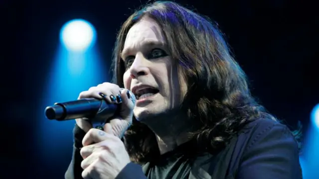 Singer Ozzy Osbourne performing with British heavy metal band Black Sabbath.