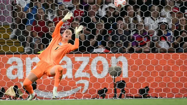 England's goalkeeper #01 Hannah Hampton dives