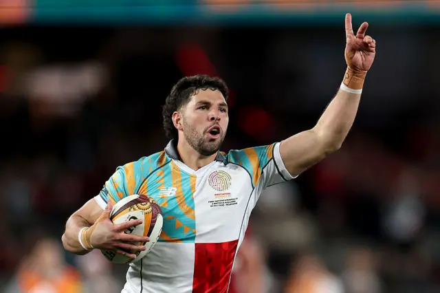 Triston Reilly of the First Nations & Pasifika scores a try