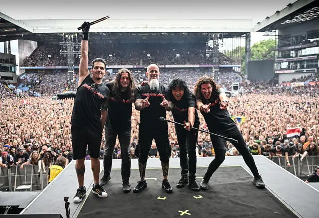 Members Anthrax pose for a photo after playing as a support act, during British rock band Black Sabbath's "Back to The Beginning" concert, Ozzy Osbourne's final ever gig as Black Sabbath's frontman at Villa Park in Birmingham, central England on July 5, 2025.