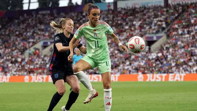 Barbara Bonansea of Italy is challenged by Keira Walsh