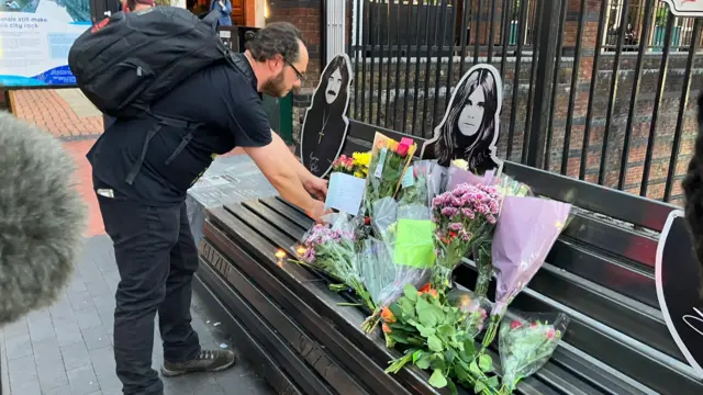 Bench with pictures of Osbourne and flowers