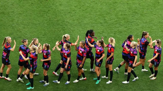 Players of England high five during the warm up prior to the UEFA Women's EURO 2025 Semi-Final match between England and Italy at Stade de Geneve