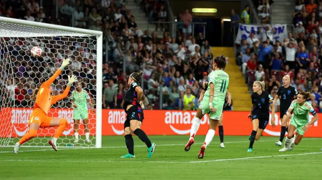 Barbara Bonansea of Italy scores her team's first goal past Lucy Bronze and Hannah Hampton of England
