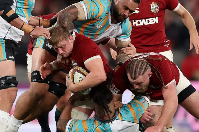 Jac Morgan carries the ball