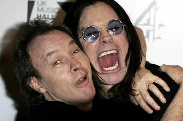 AC/DC guitarist Angus Young pictured next to Black Sabbath vocalist Ozzy Osbourne
