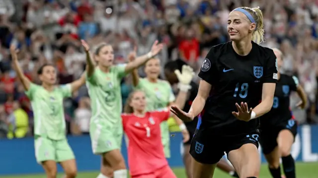 England's forward #18 Chloe Kelly (R) celebrates after scoring her team's second goal