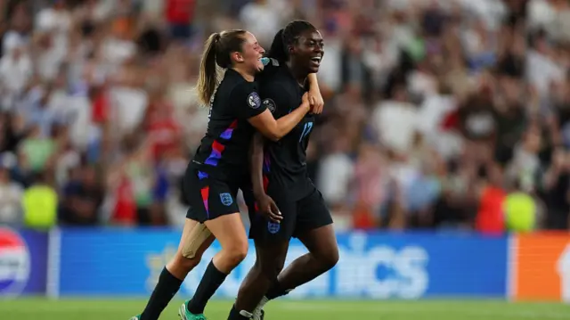 Michelle Agyemang of England celebrates scoring her team's first goal with teammate Ella Toone