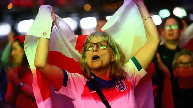 A fan of England reacts
