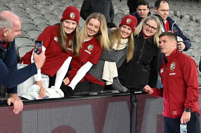 British and Irish Lions' captain Owen Farrell poses for pictures with fans