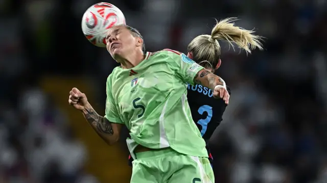 Elena Linari of Italy competes for the ball with Alessia Russo of England