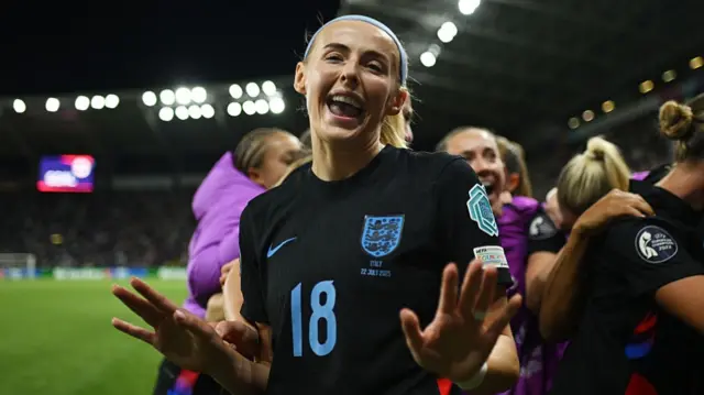 Chloe Kelly of England celebrates after scoring her team's second goal from a rebound following a saved penalty in extra-time