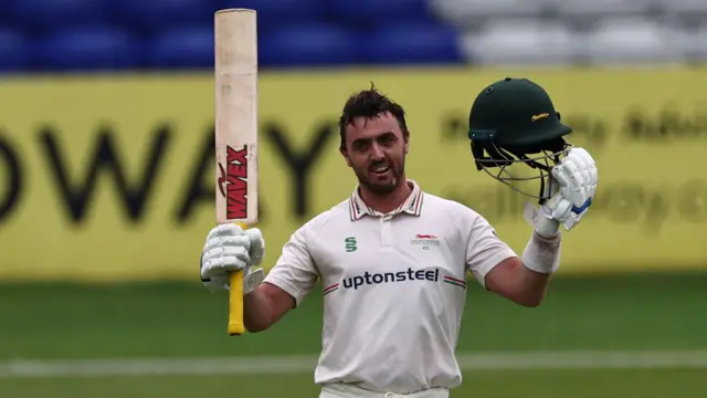 Lewis Hill celebrates his century for Leicestershire at Derbyshire