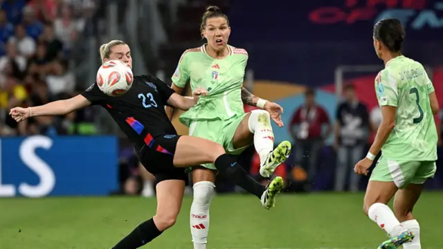 England's forward #23 Alessia Russo (L) vies with Italy's defender #05 Elena Linari (C)